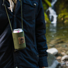 Load image into Gallery viewer, Kevin Perron wearing the Green Crows Nest Coozie in Neoprene by Treefort Lifestyles.