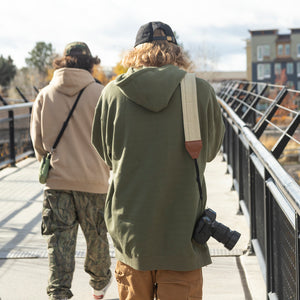 Miles with the New Lookout Camera Strap in Tan by Treefort Lifestyles.